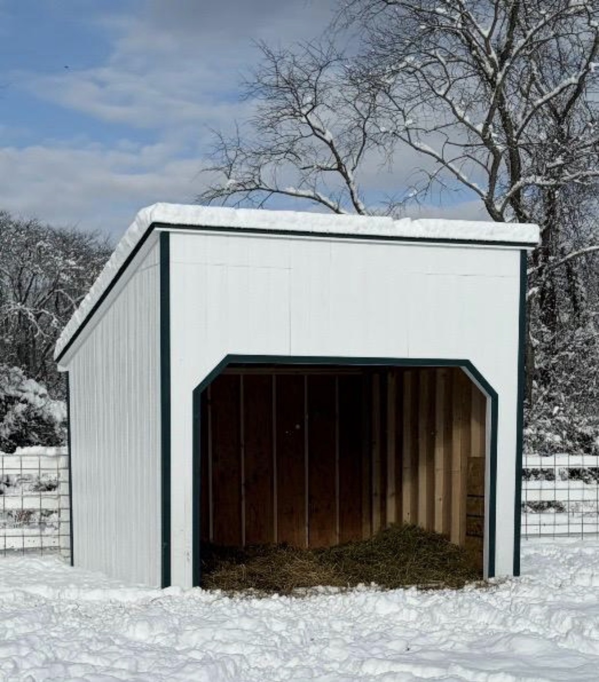 White run-in shelter on a snowy winter day