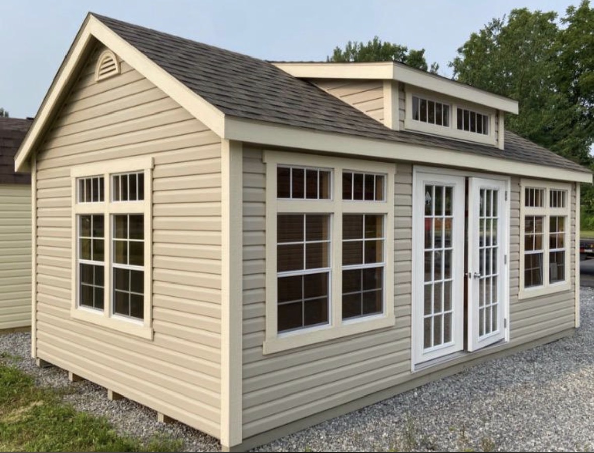Premium studio shed with multiple windows, built by Outdoor Adventures USA